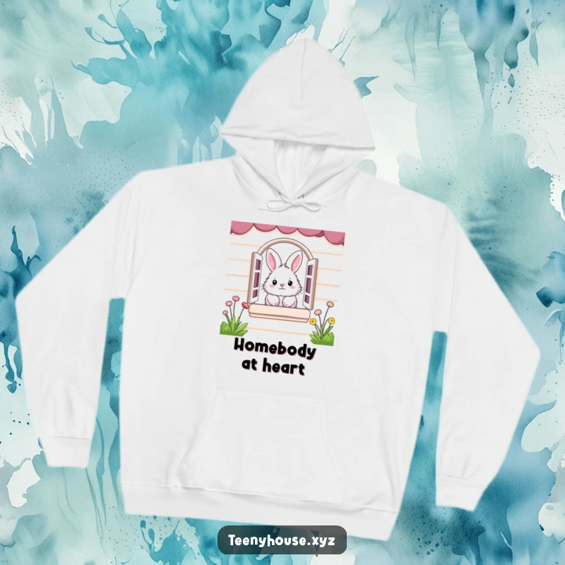 Funny Hoodie: Fluffy bunny peeking from a miniature house window, offering cozy and humorous comfort.