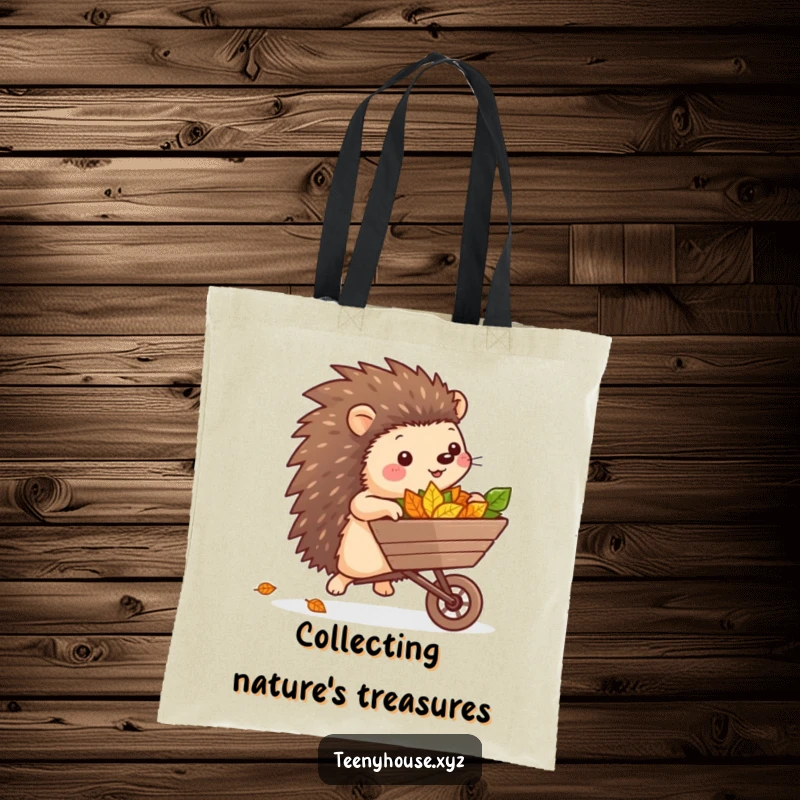 Funny Hedgehog Leaf Tote Bag: A cheerful hedgehog with a wheelbarrow full of leaves, adding a touch of playful garden humor to your day.